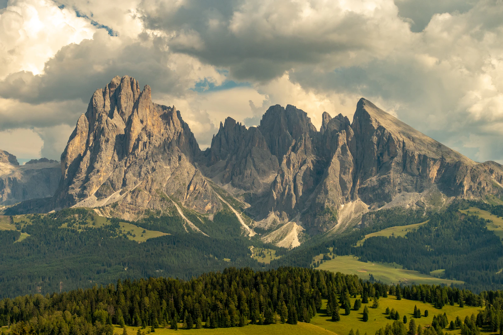 Golden light on the Dolomites above the meadows of Alpe di Siusi, Italy
